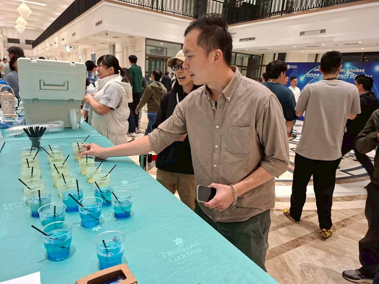 Guests picking up colourful signature cocktails at the bar