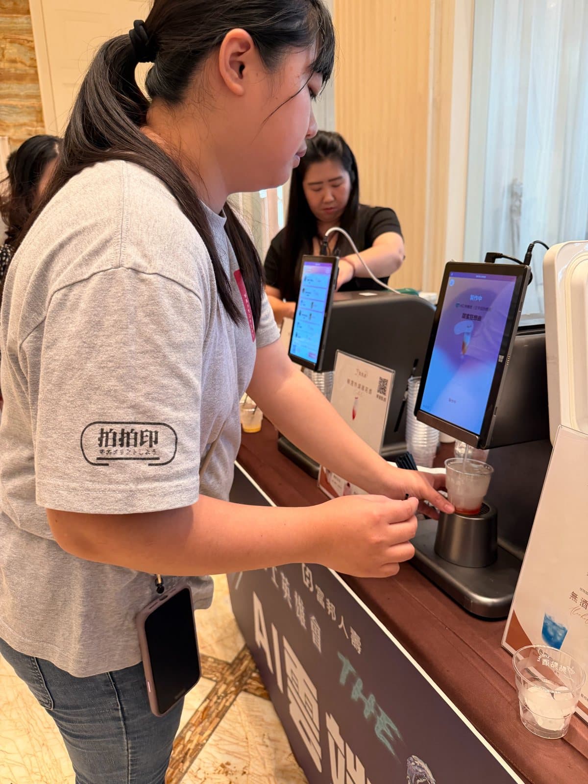 Pixanity crew confirming orders on the machine touchscreen