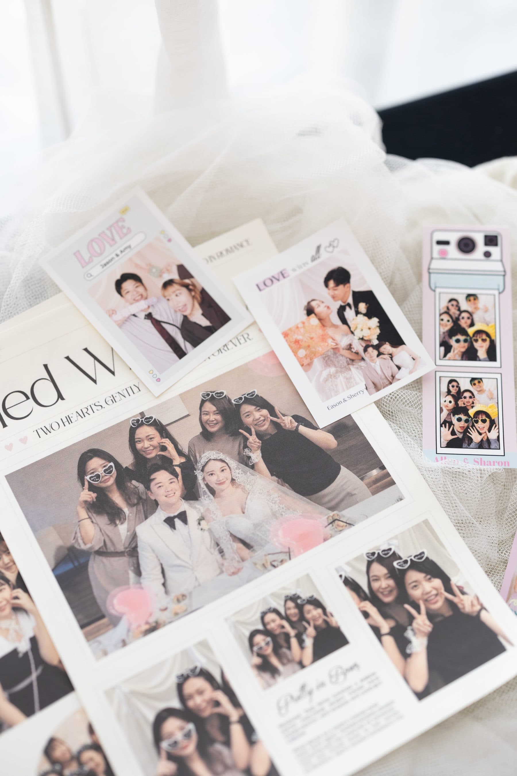 The newspaper alongside photo strips and framed prints from the same event