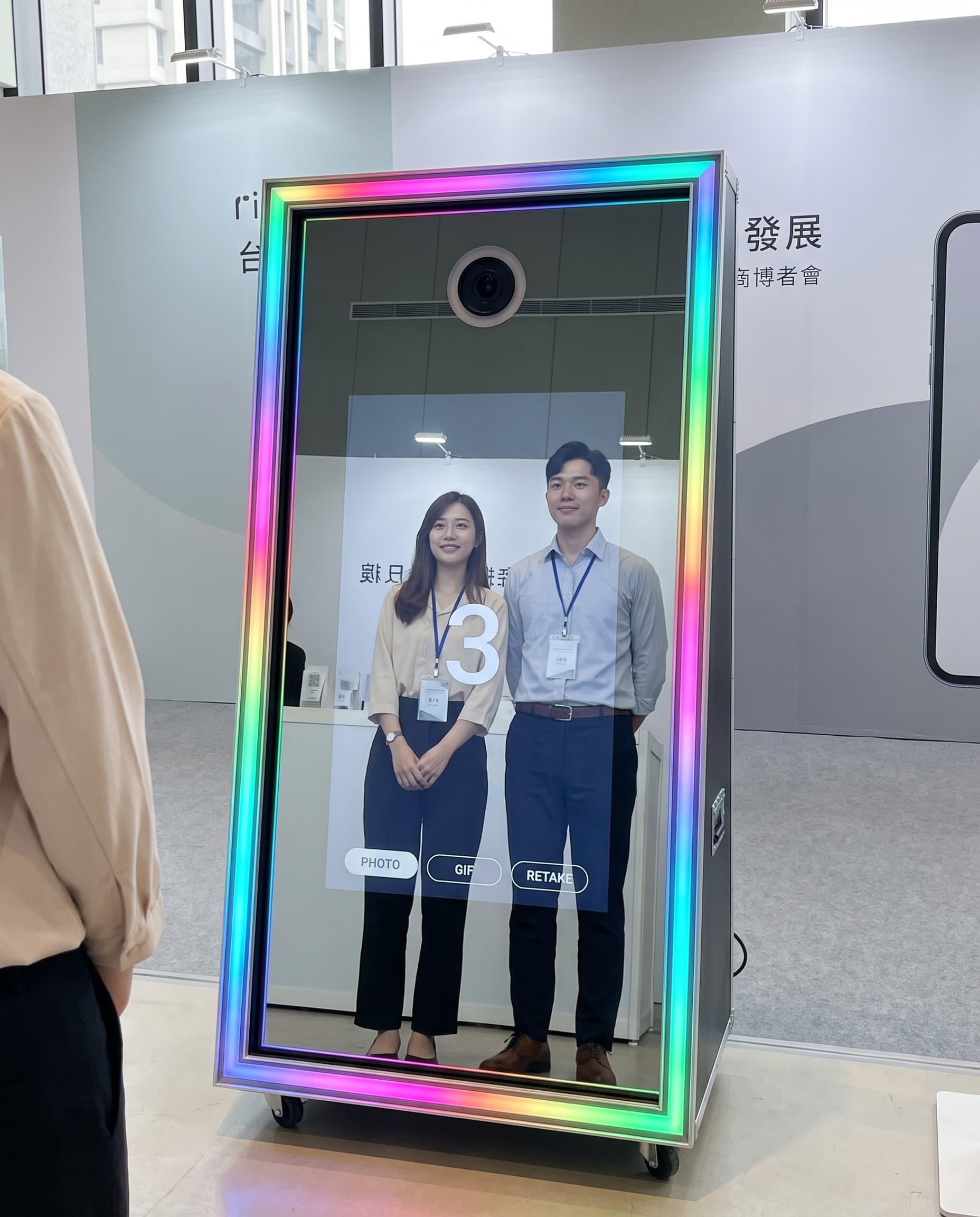 Guests and brand staff interacting at the magic mirror at a launch