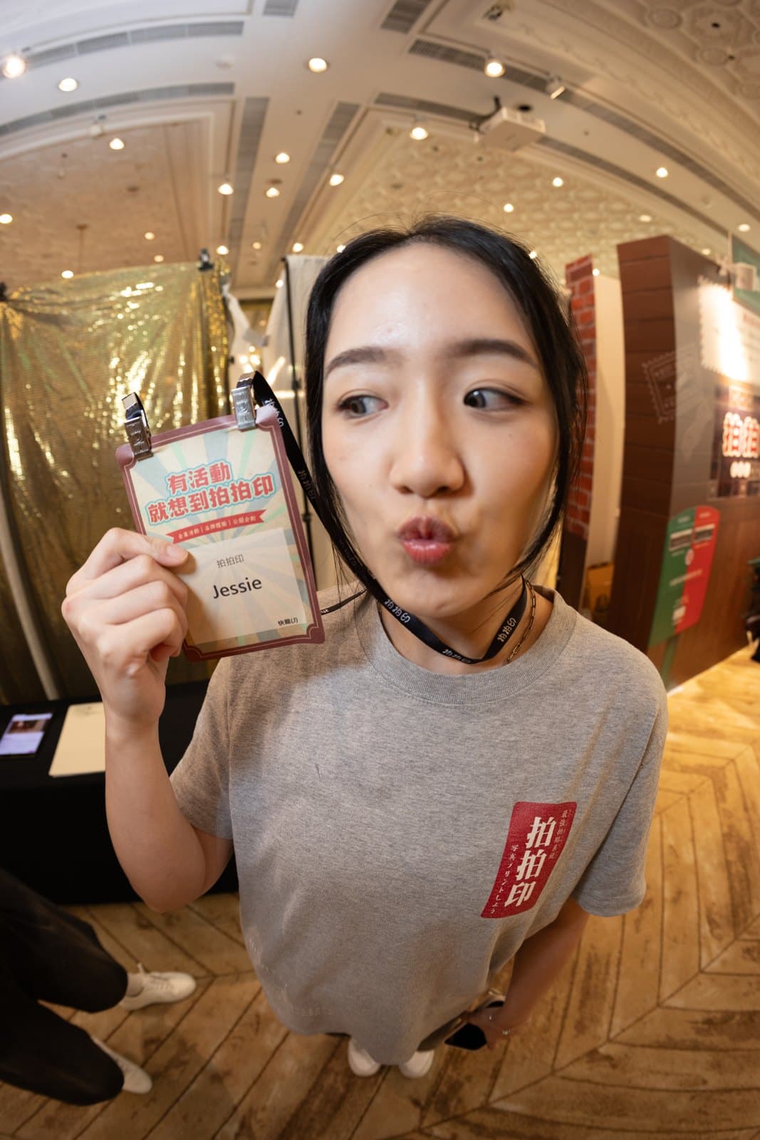 Guest holding up a badge