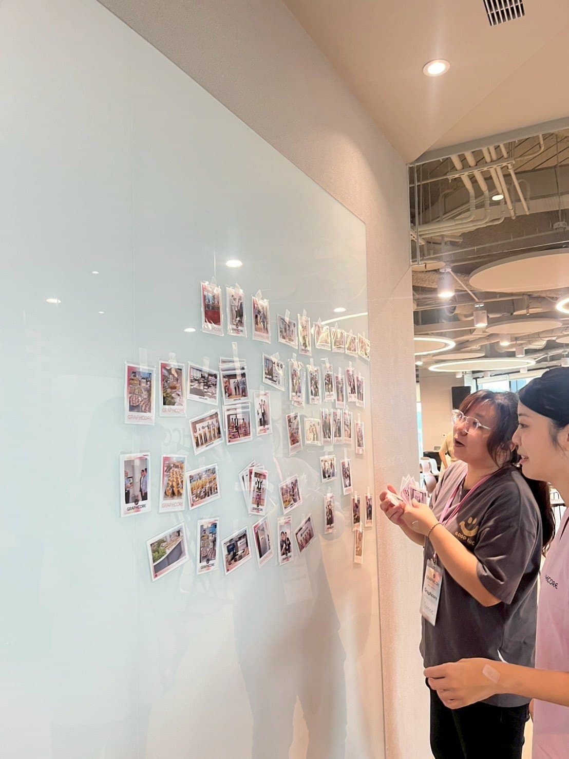Graphcore opening — roving photographer shots printed live on site and pinned into a memory wall