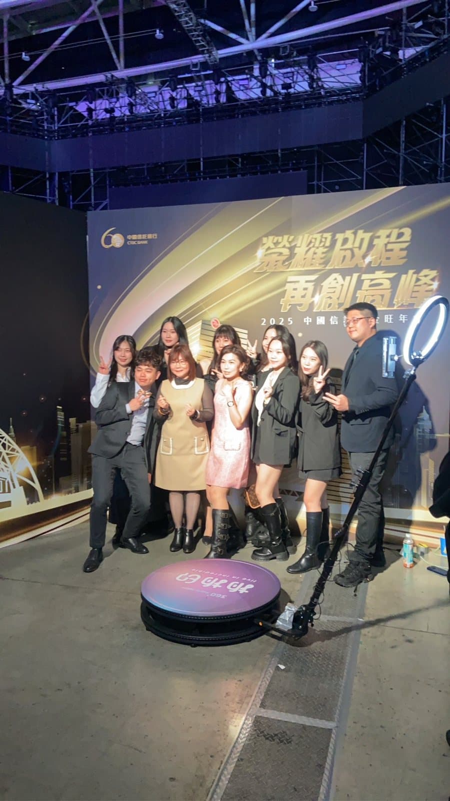 A group of gala guests posing with the 360 video booth