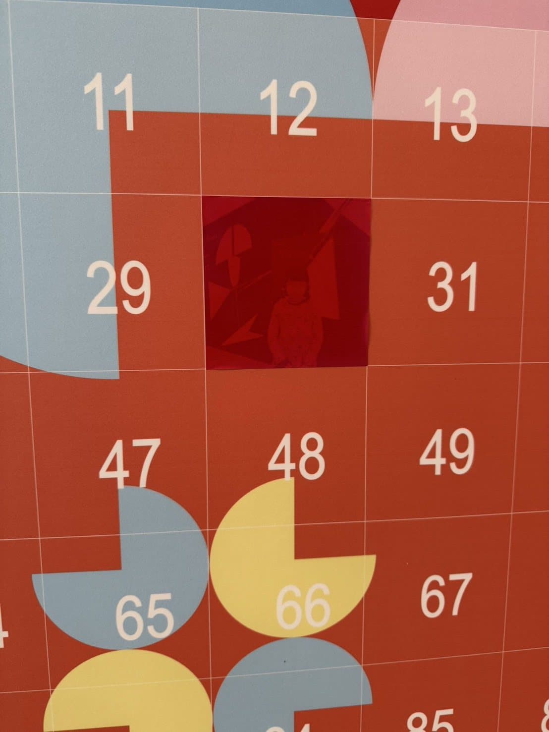 Close-up of the numbered base grid — each photo is pasted tile by tile onto its matching number