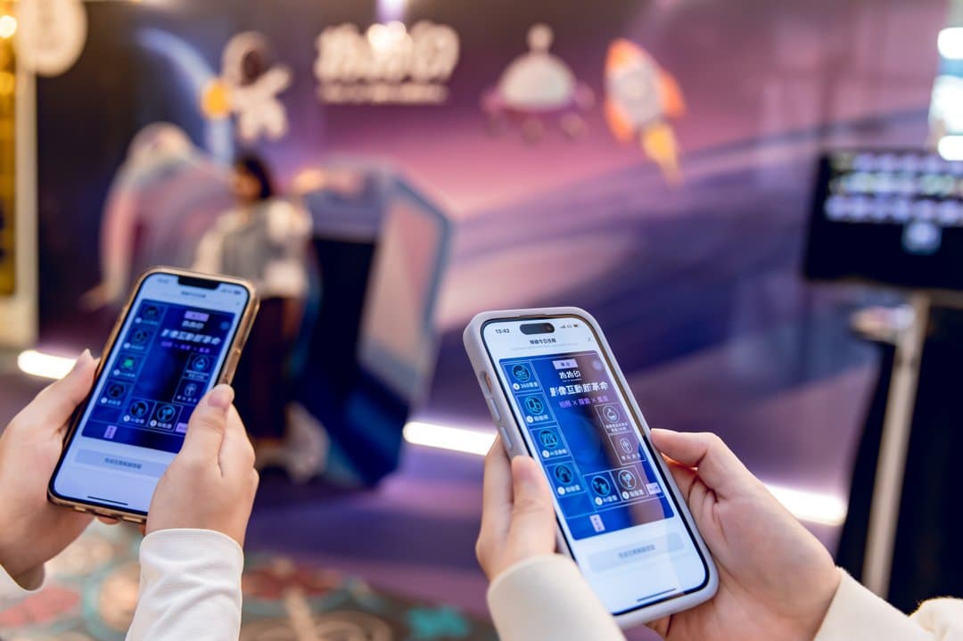 Guests interacting on their phones at the carnival
