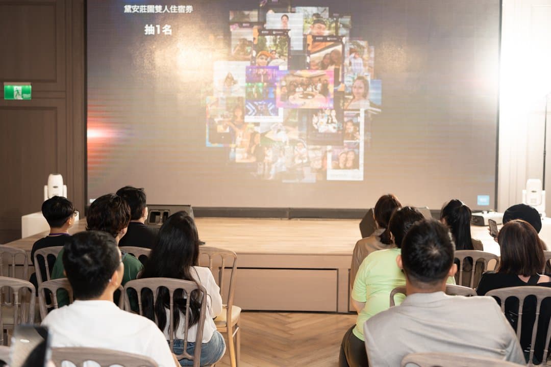Guest photos gathered into a cloud as a full house waits in anticipation