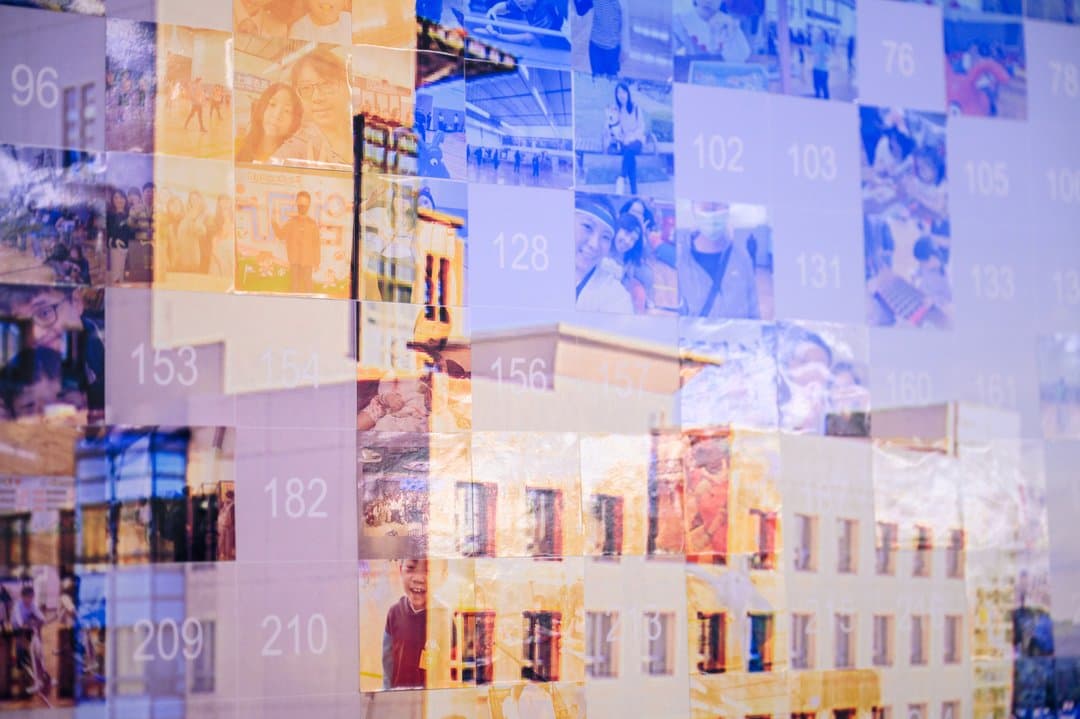 City skyline key visual — up close, every tile is a guest photo